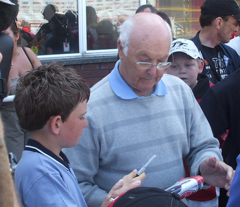 Murray Walker OBE meets fans during the Centenary TT in 2007